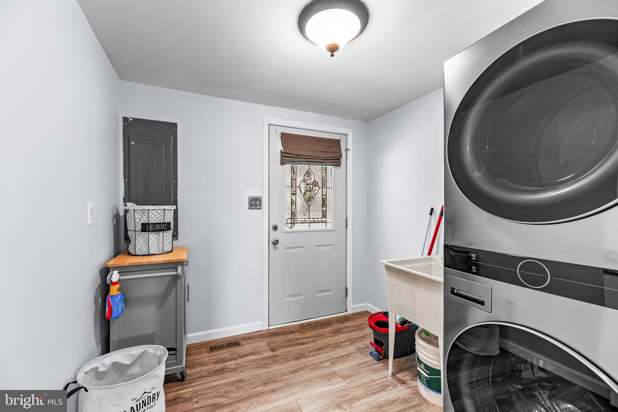 9235 Pardoe Road Lusby, MD 20657 - Photo 13 of 28 Great mudroom with full size stacked washer/dryer.
