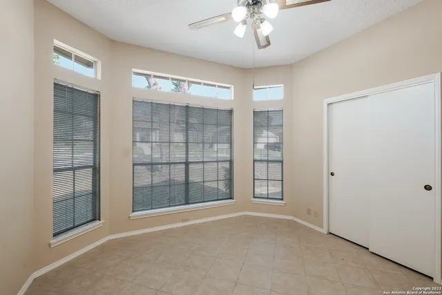 a view of an empty room with a bathroom