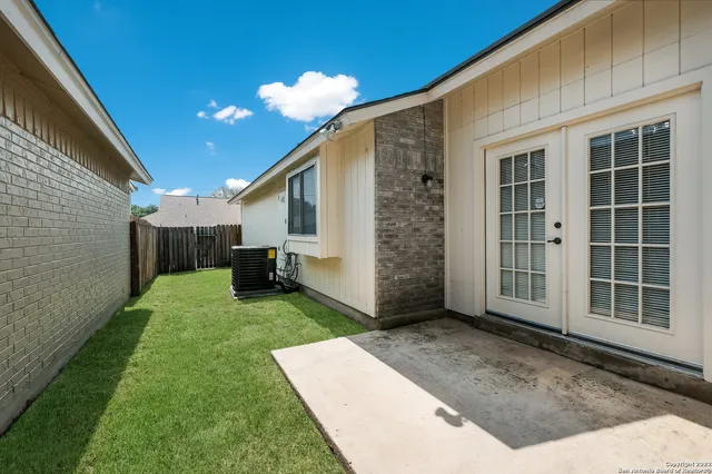 a view of a back yard of the house