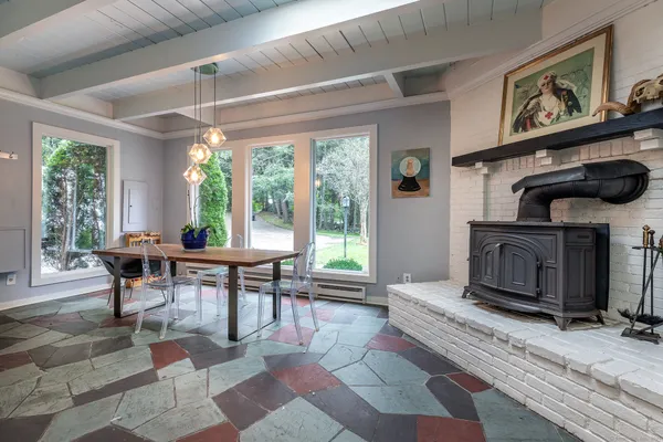 a living room with furniture a window and a fireplace