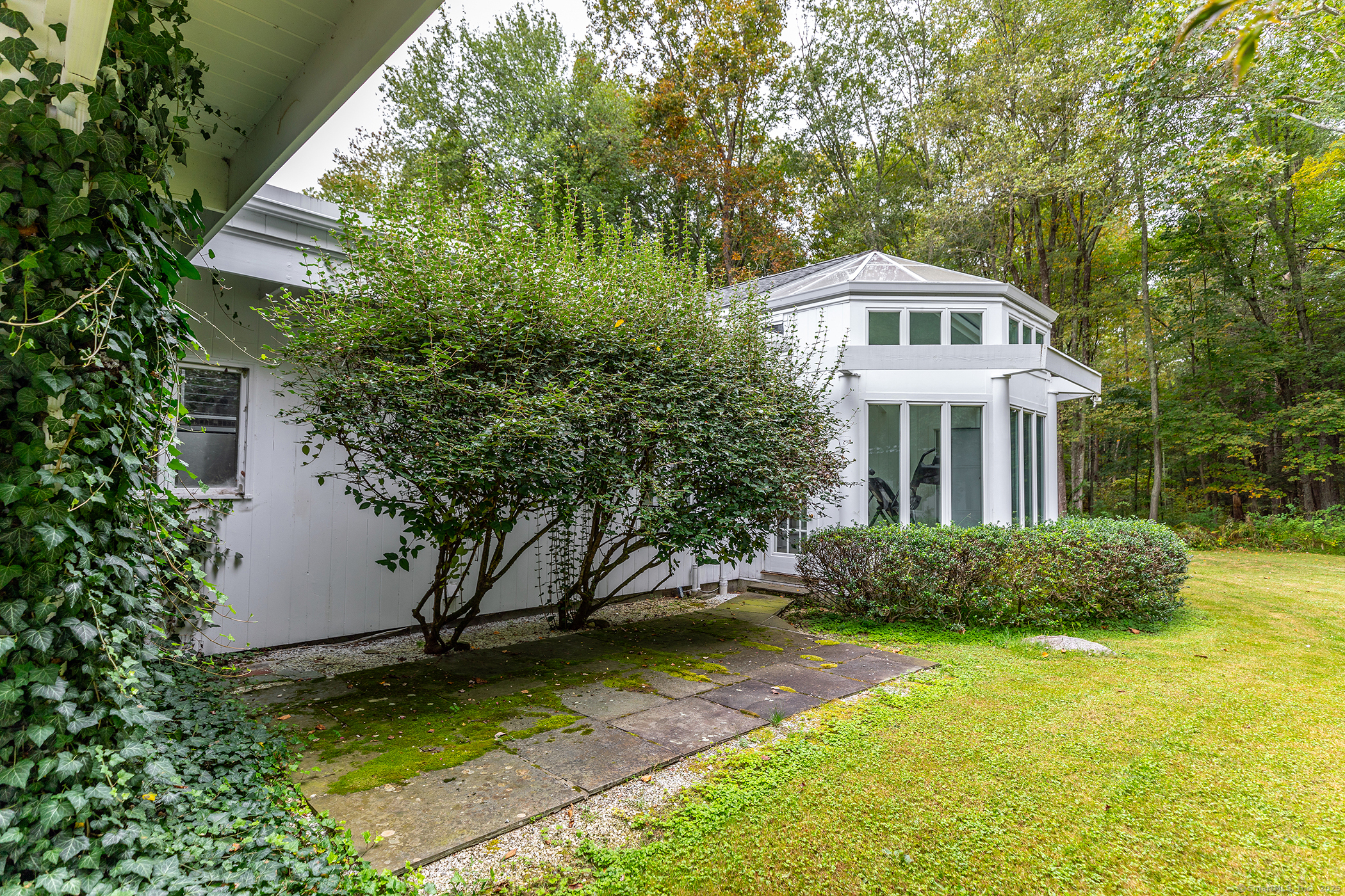 116 Wellers Bridge Road Roxbury, CT 06783 - Photo 21 of 25 a front view of a house with a yard
