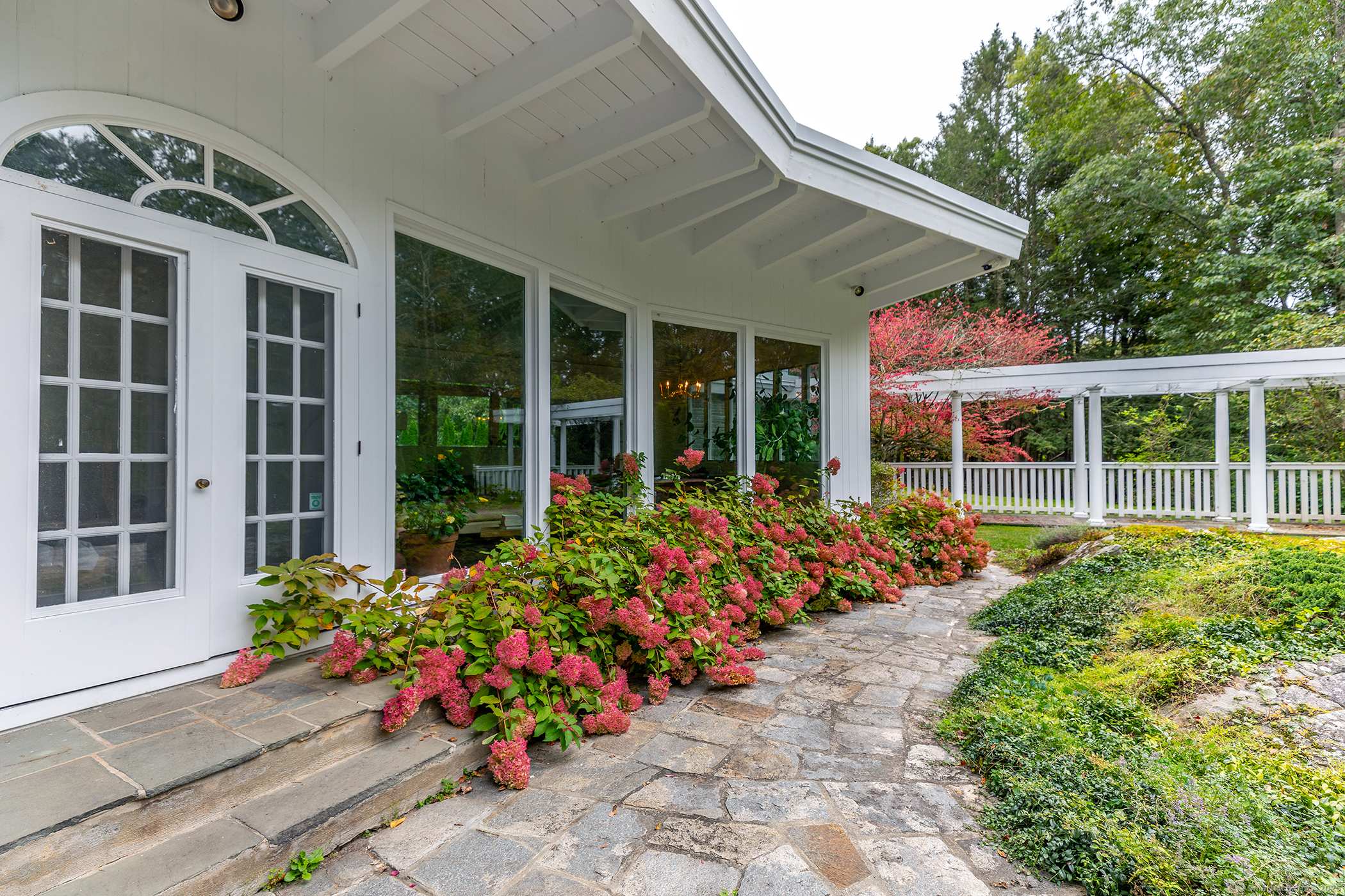 116 Wellers Bridge Road Roxbury, CT 06783 - Photo 22 of 25 a view of a house with a flower garden