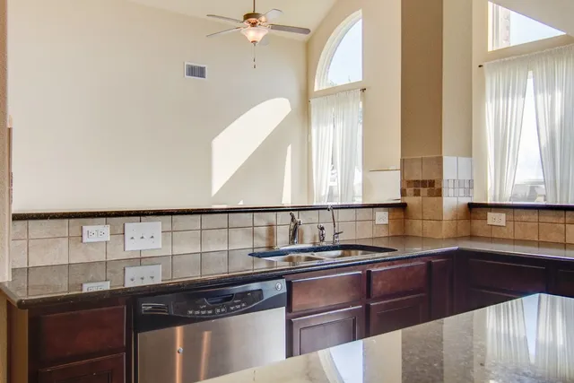a kitchen with a sink and a window