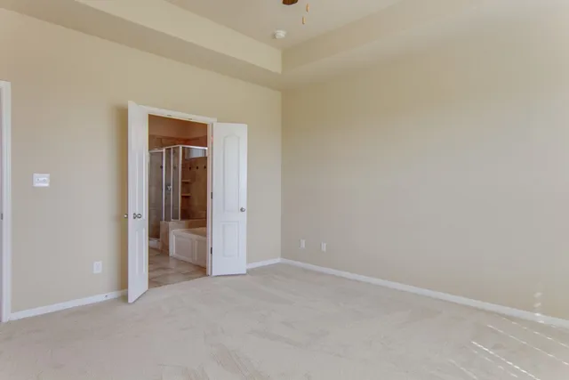 a view of an empty room and closet area