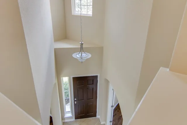 a view of hallway with windows