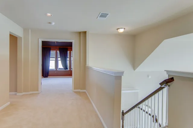 a view of hallway with livingroom