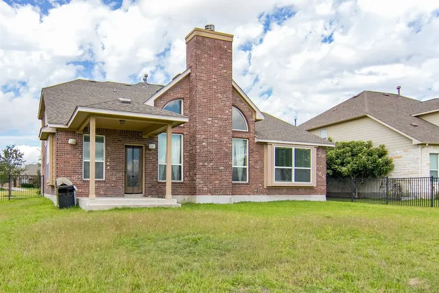 a front view of a house with a garden and porch
