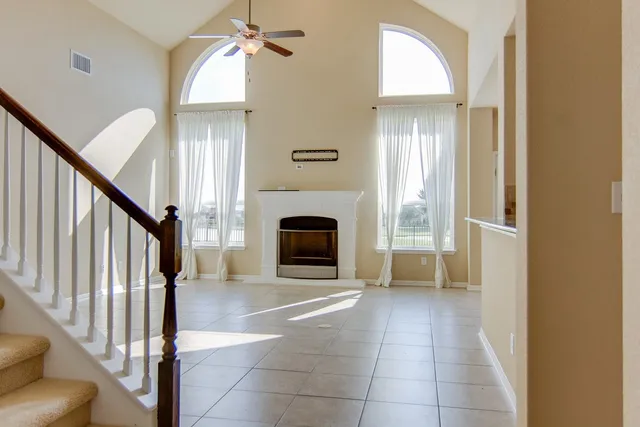 a view of an entryway with fireplace and a window