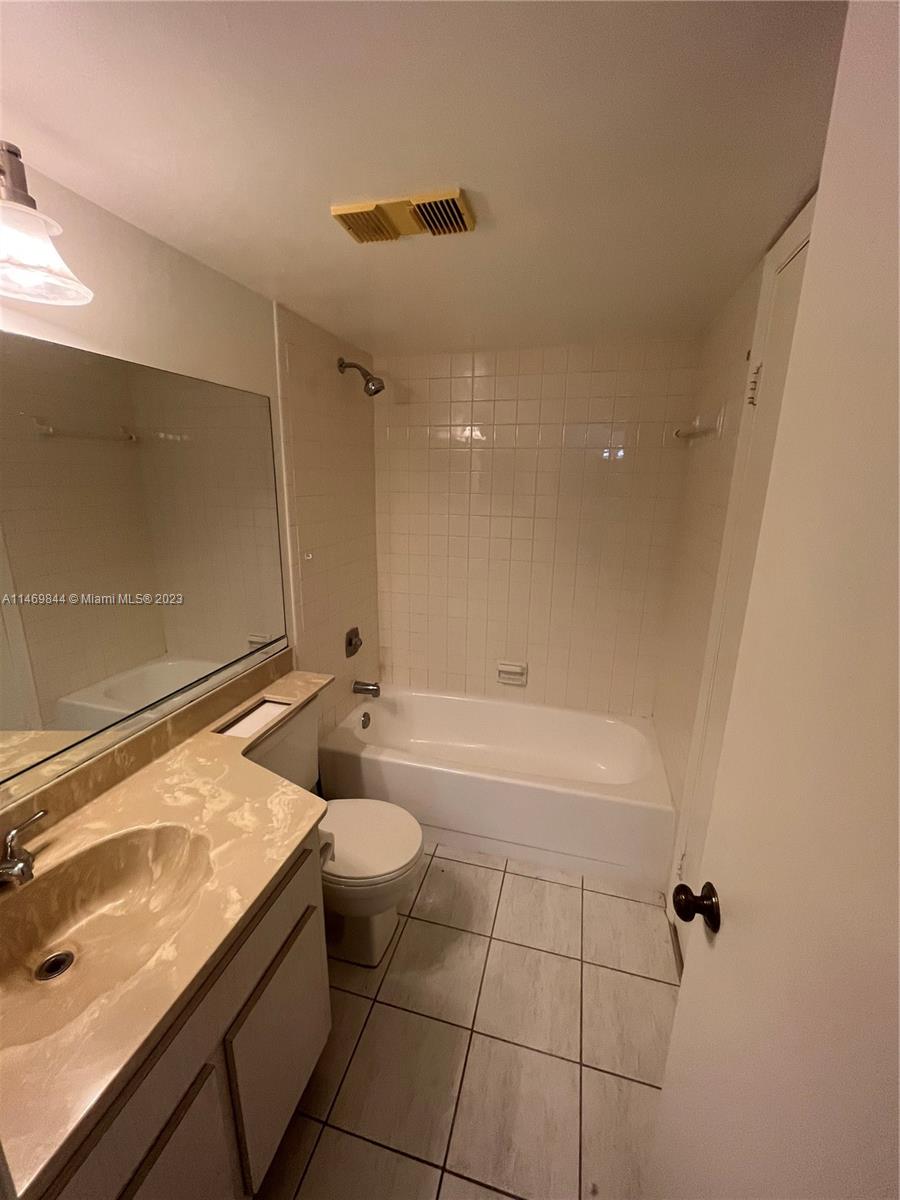 The Crossings Miami, FL 33186 - Photo 9 of 14 a bathroom with a granite countertop sink a toilet and bathtub