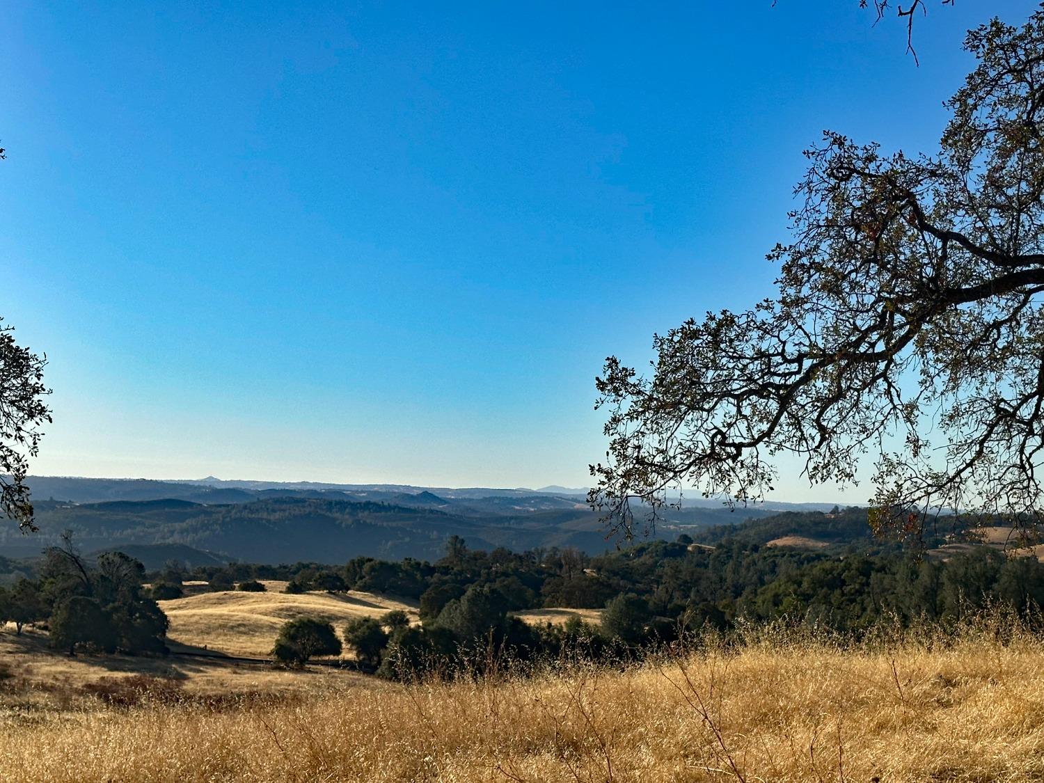 7388 Brandon Road Shingle Springs, CA 95682 - Photo 14 of 40 a view of a lake with a mountain in the background