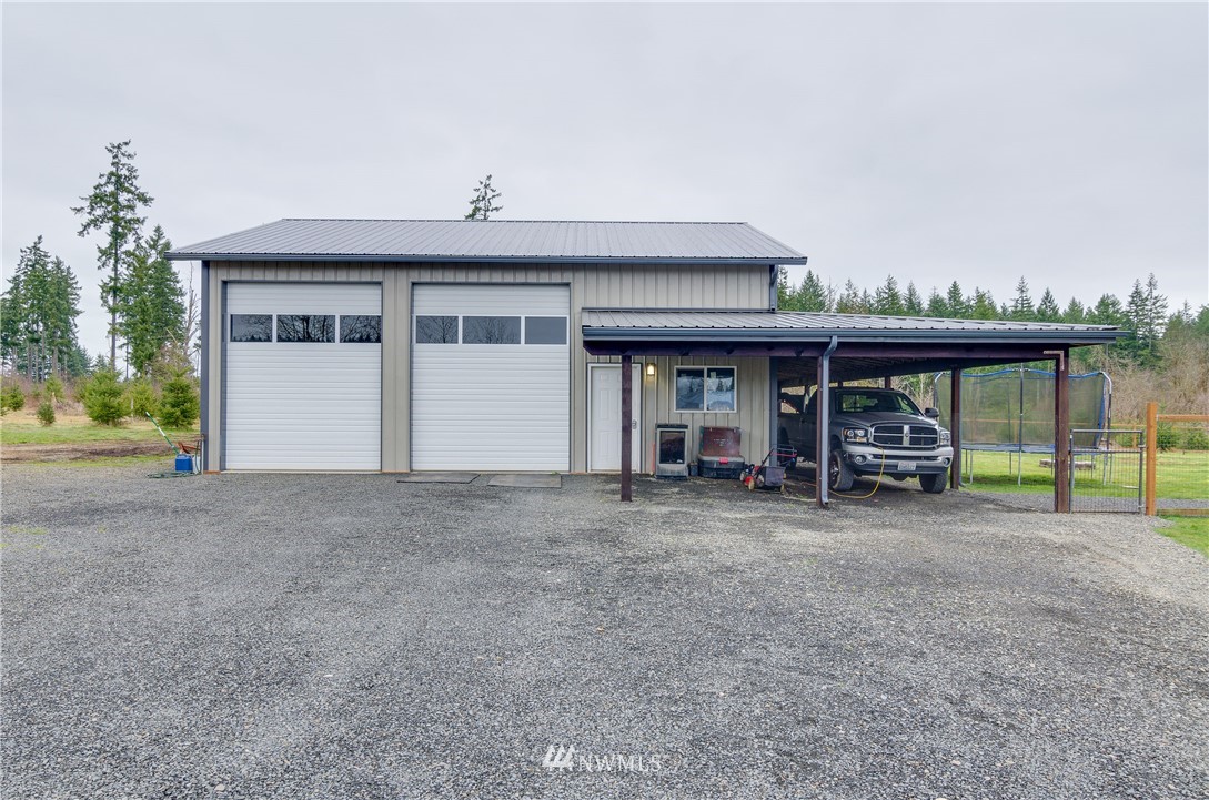 243 Gartner Road Winlock, WA 98596 - Photo 22 of 38 a view of a house with a porch and furniture