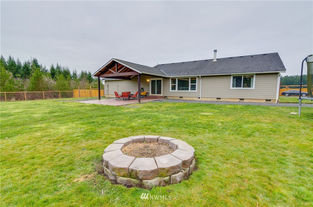 243 Gartner Road Winlock, WA 98596 - Photo 25 of 38 a front view of a house with a yard