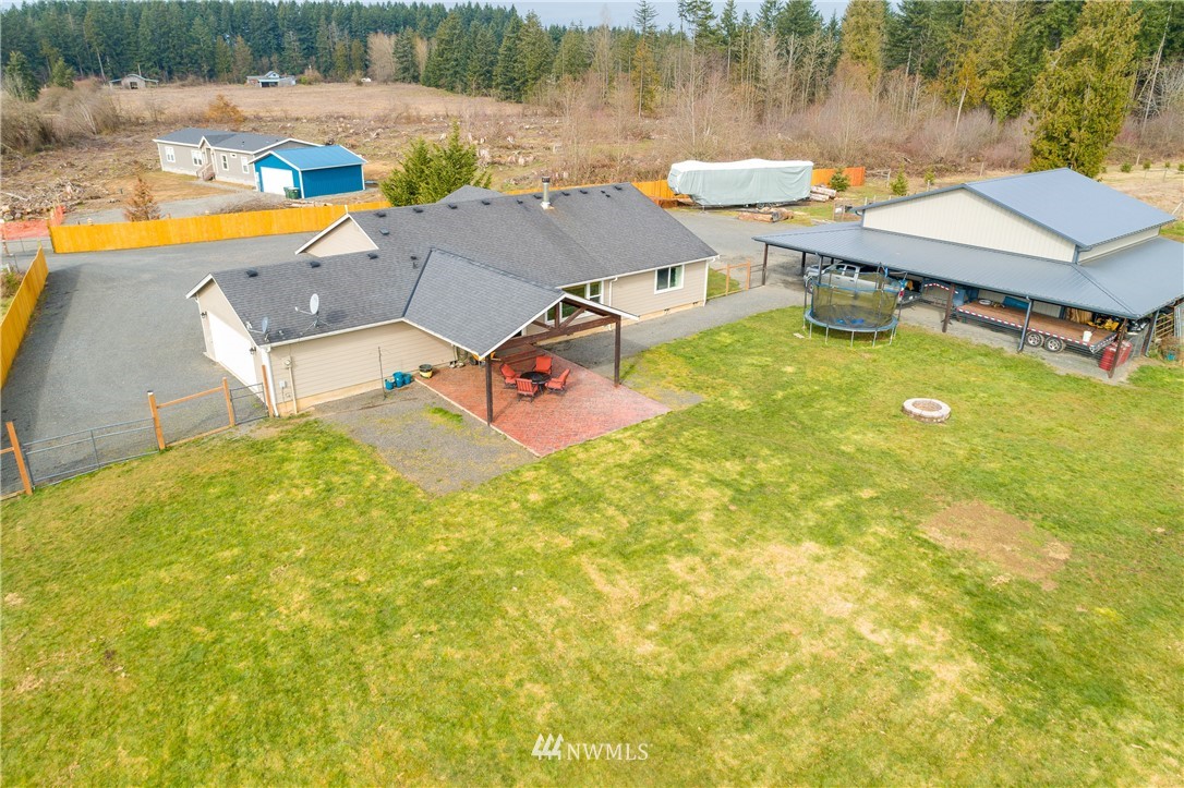 243 Gartner Road Winlock, WA 98596 - Photo 32 of 38 an aerial view of a house with swimming pool and lake view