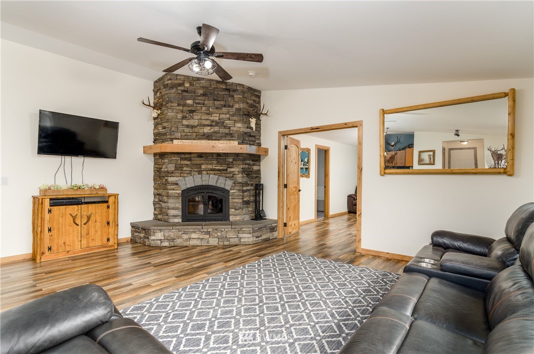243 Gartner Road Winlock, WA 98596 - Photo 5 of 38 a living room with furniture and a fireplace