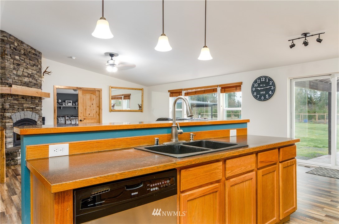 243 Gartner Road Winlock, WA 98596 - Photo 7 of 38 a kitchen with a sink cabinets and window
