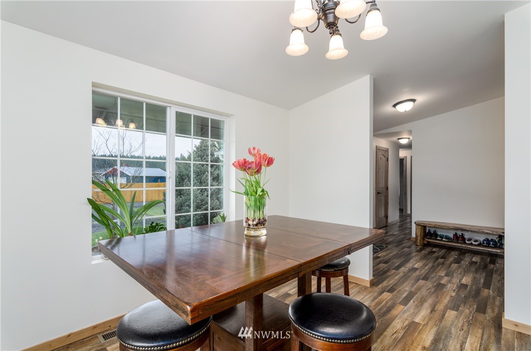 243 Gartner Road Winlock, WA 98596 - Photo 10 of 38 a dining room with furniture and wooden floor