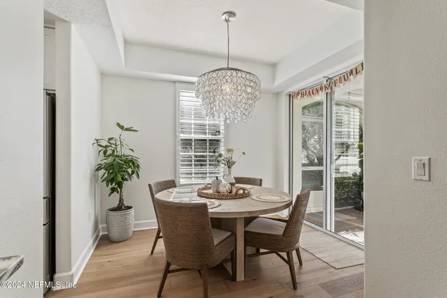 a bedroom with a bed and a potted plant