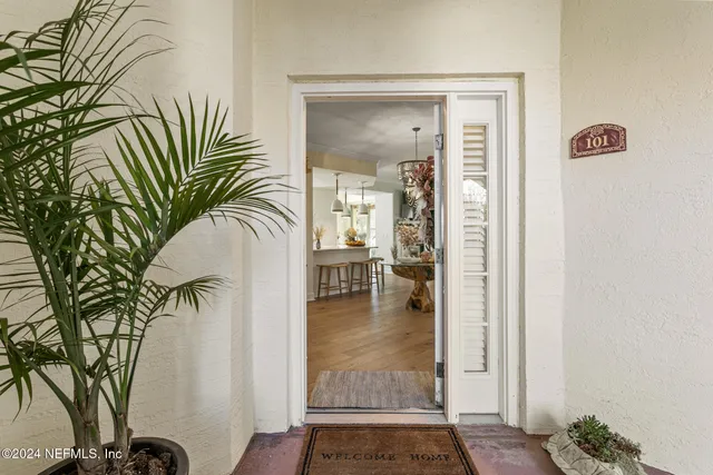 a living room with fireplace furniture and a wooden floor