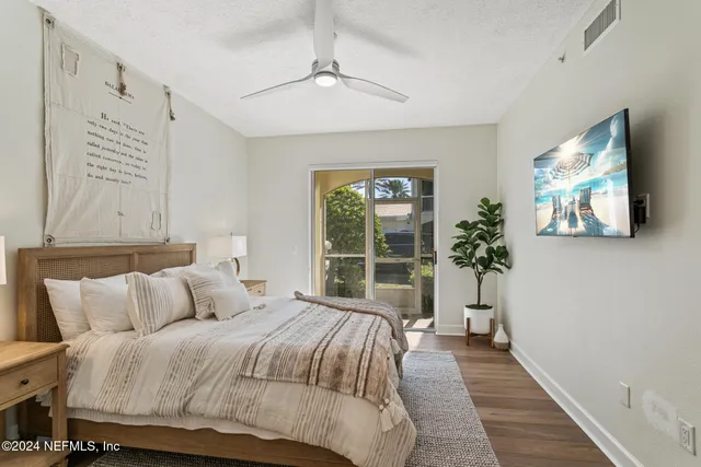 a blue and white car parked in front of a building
