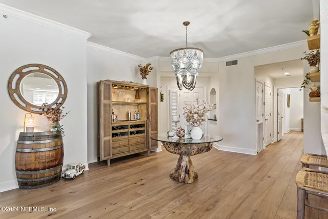 a view of a livingroom with furniture a fireplace and wooden floor