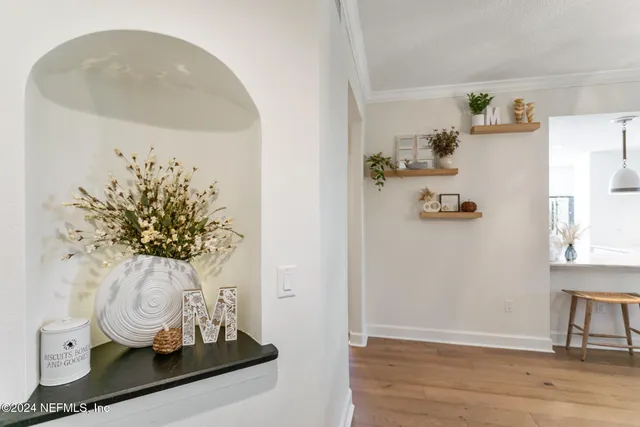 a kitchen with kitchen island granite countertop a sink cabinets and window