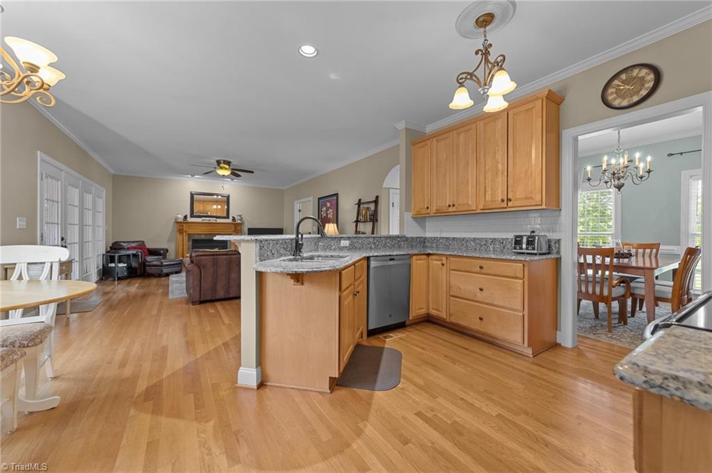 5806 Billet Road Oak Ridge, NC 27310 - Photo 15 of 46 KITCHEN WITH GRANITE TOPS AND STAINLESS APPLIANCES