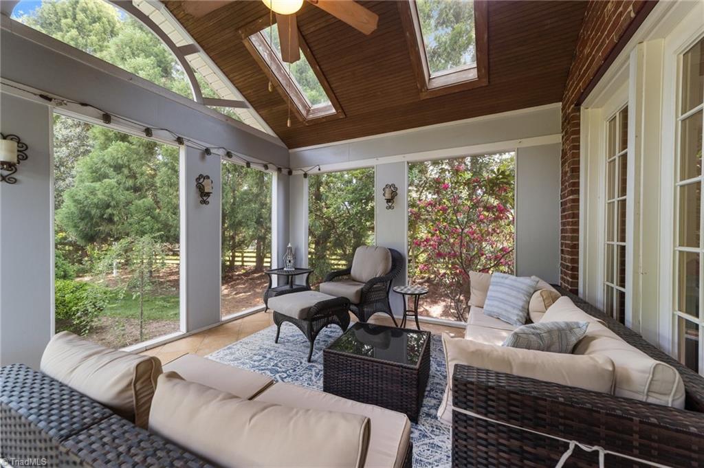 5806 Billet Road Oak Ridge, NC 27310 - Photo 20 of 46 SCREENED PORCH WITH SKYIGHTS AND WOOD CEILING DETAILS