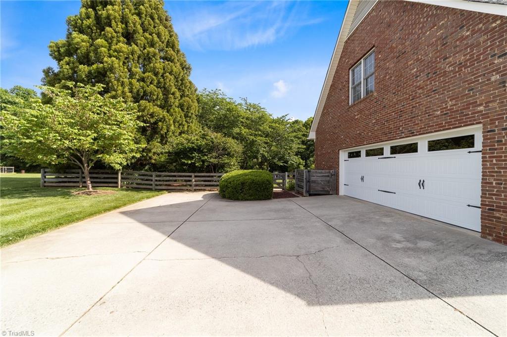 5806 Billet Road Oak Ridge, NC 27310 - Photo 3 of 46 AMPLE PARKING IN THE GARAGE OR WIDE DRIVEWAY