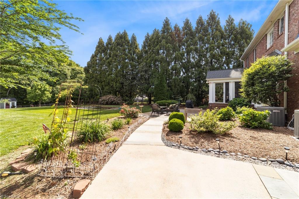 5806 Billet Road Oak Ridge, NC 27310 - Photo 4 of 46 CONCRETE WALK AROUND TO REAR OF HOME ADDED BY SELLERS