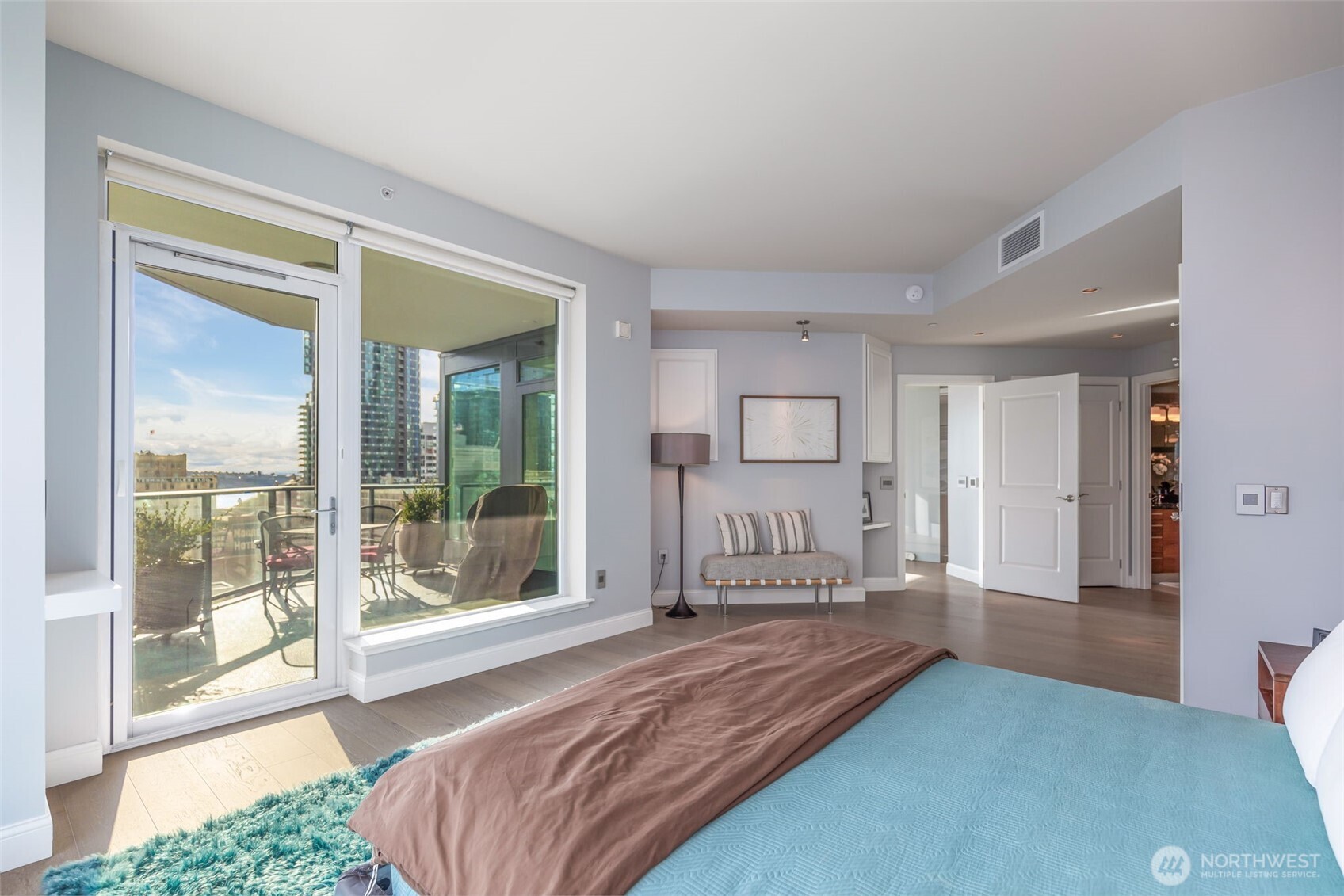 1920 4th Avenue, Unit 1405 Seattle, WA 98101 - Photo 21 of 40 a bedroom with a bed and a large window