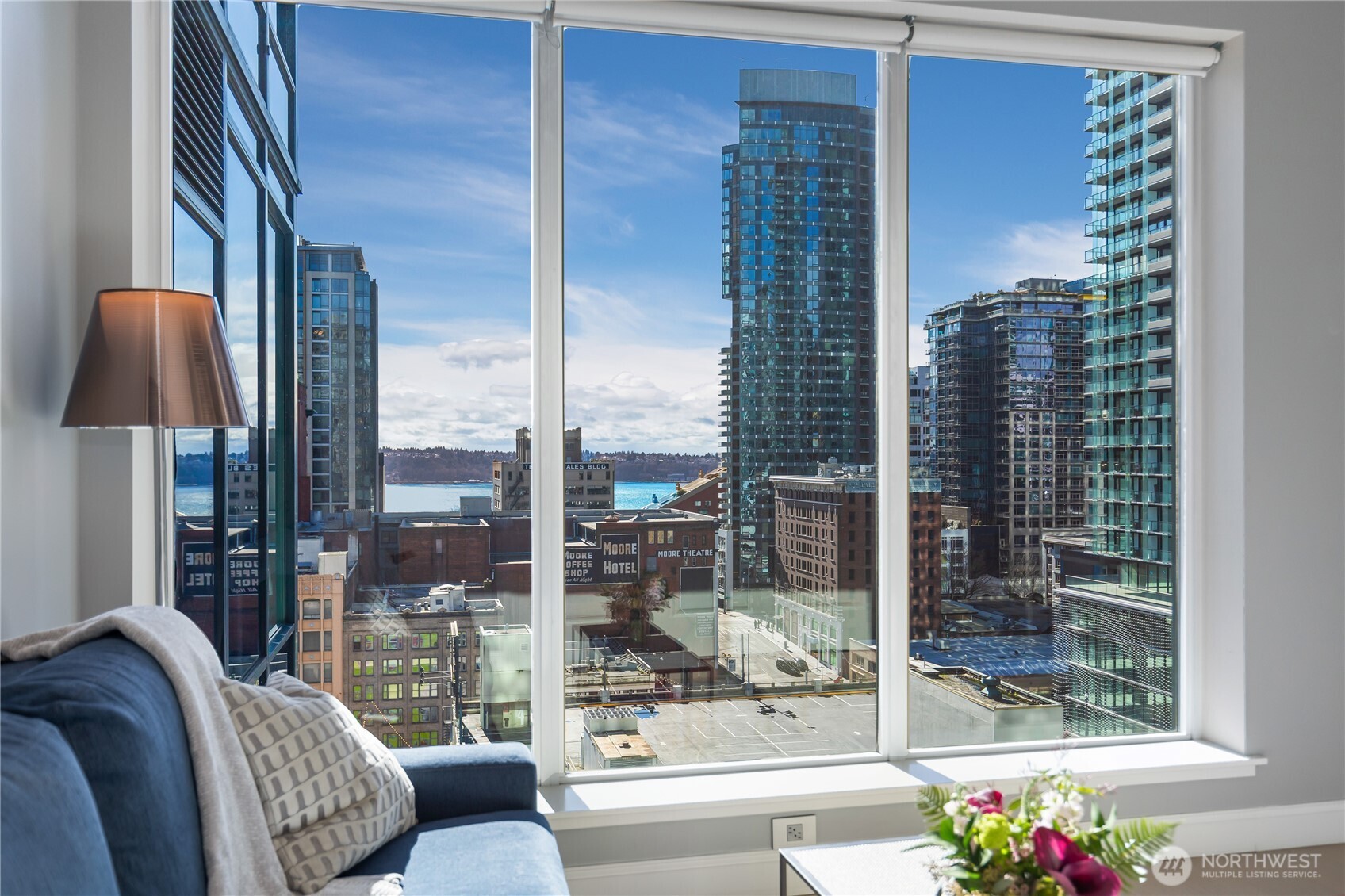 1920 4th Avenue, Unit 1405 Seattle, WA 98101 - Photo 25 of 40 a living room with furniture and a floor to ceiling window