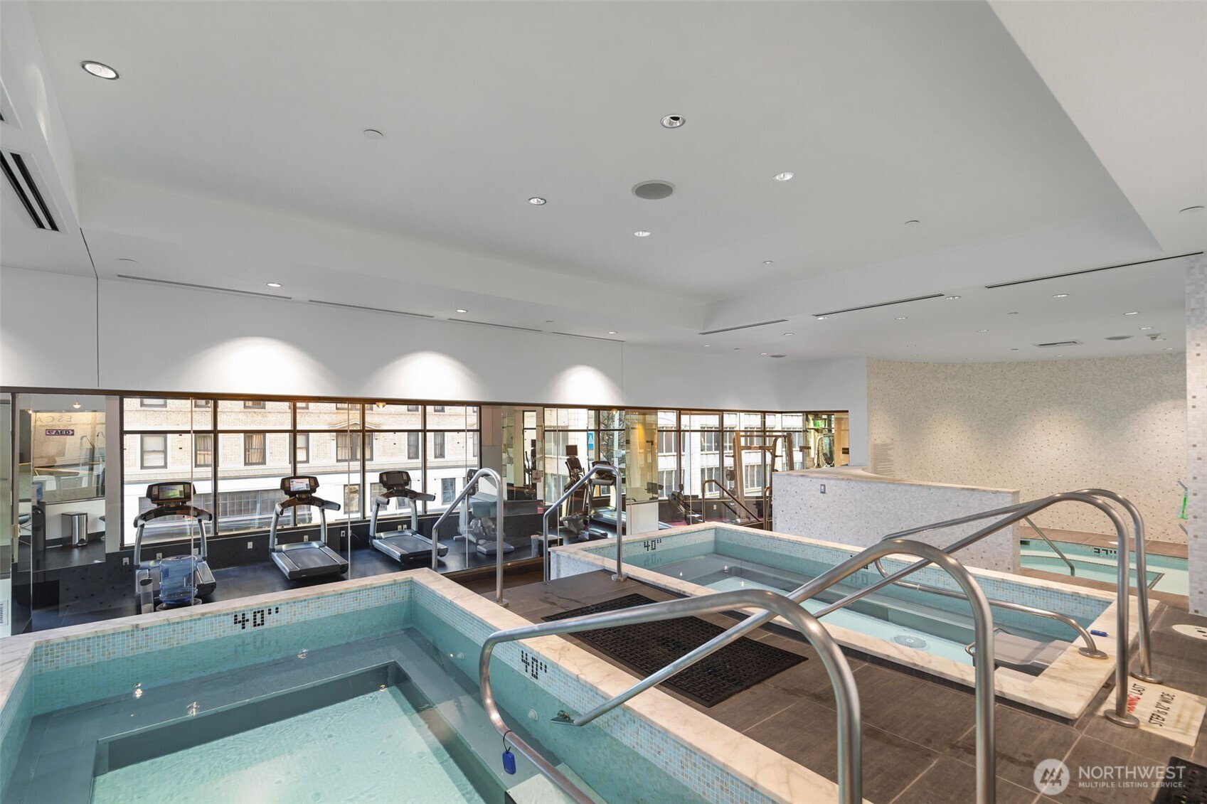 1920 4th Avenue, Unit 1405 Seattle, WA 98101 - Photo 31 of 40 a view of a swimming pool with outdoor seating