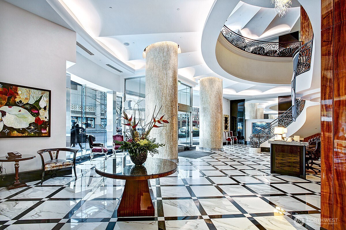 1920 4th Avenue, Unit 1405 Seattle, WA 98101 - Photo 37 of 40 a lobby with furniture and a floor to ceiling window