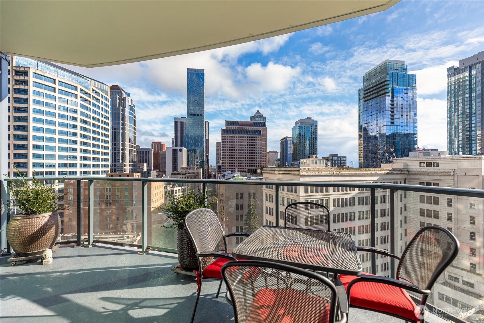 1920 4th Avenue, Unit 1405 Seattle, WA 98101 - Photo 6 of 40 a balcony with table and chairs