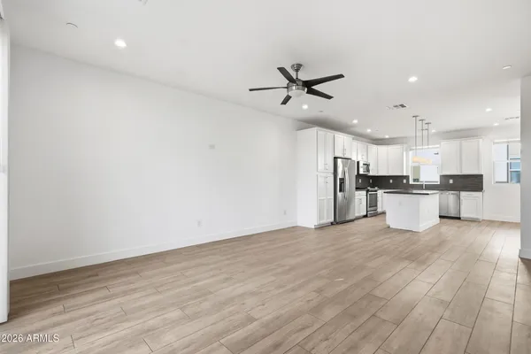 a view of kitchen with wooden floor and window