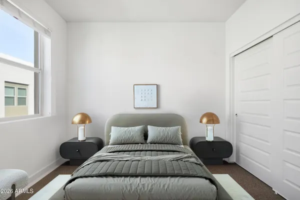 a bedroom with a bed window and wall painting