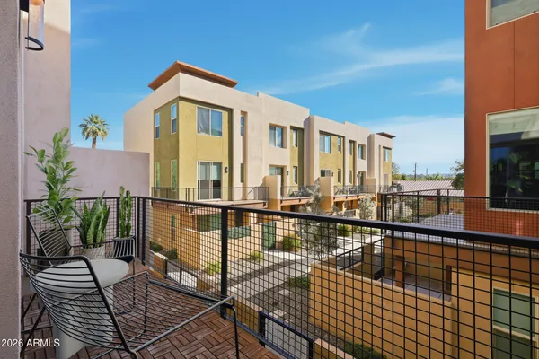 a view of a balcony with wooden floor
