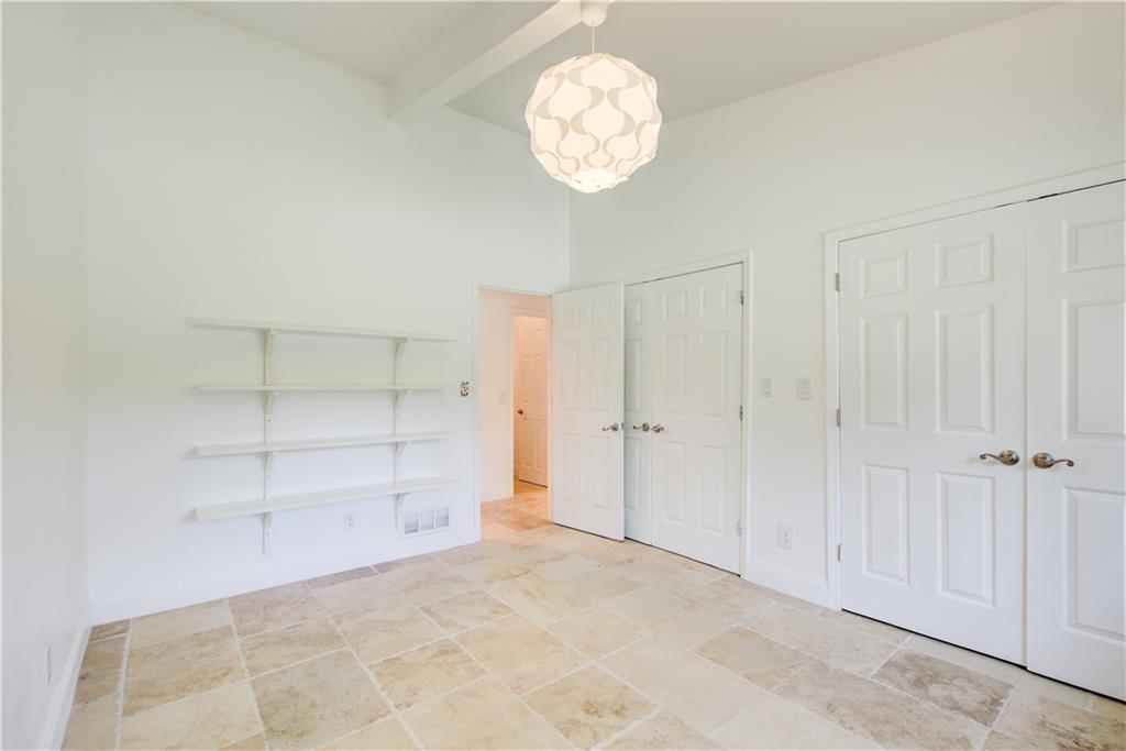 1676 Moores Mill Road Northwest Atlanta, GA 30327 - Photo 16 of 32 wooden floor in an empty room