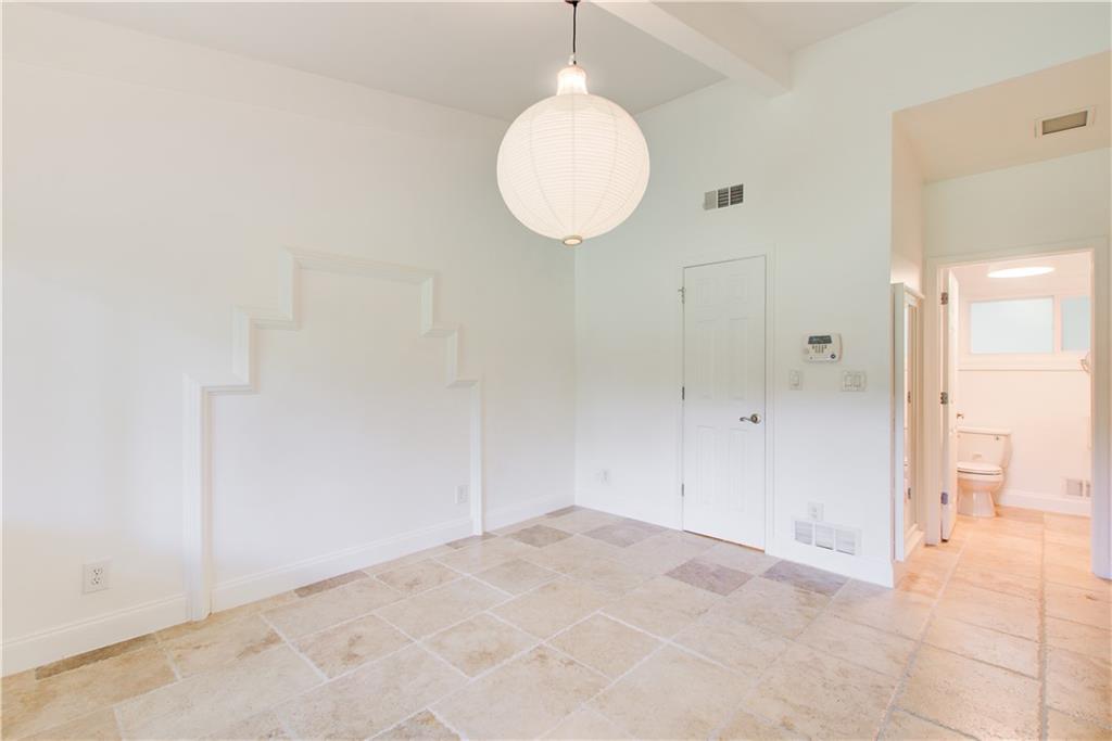 1676 Moores Mill Road Northwest Atlanta, GA 30327 - Photo 18 of 32 a view of a room with wooden floor and glass doors