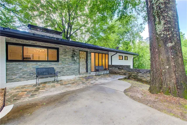 a backyard of a house with seating space