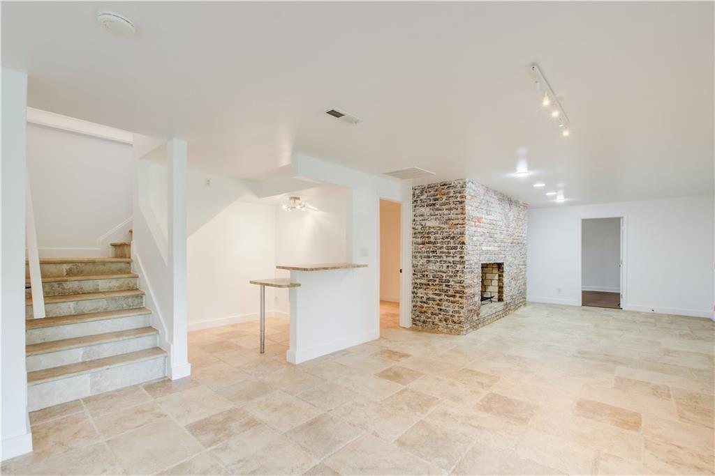 1676 Moores Mill Road Northwest Atlanta, GA 30327 - Photo 23 of 32 a view of an empty room with a window