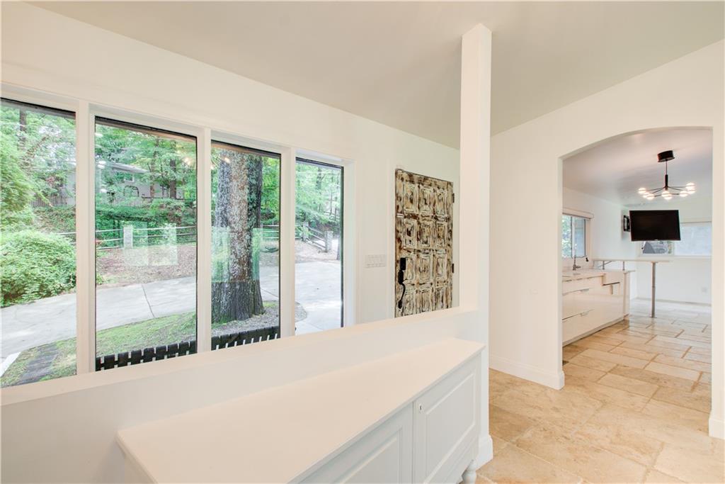 1676 Moores Mill Road Northwest Atlanta, GA 30327 - Photo 6 of 32 a very nice looking room with a large window