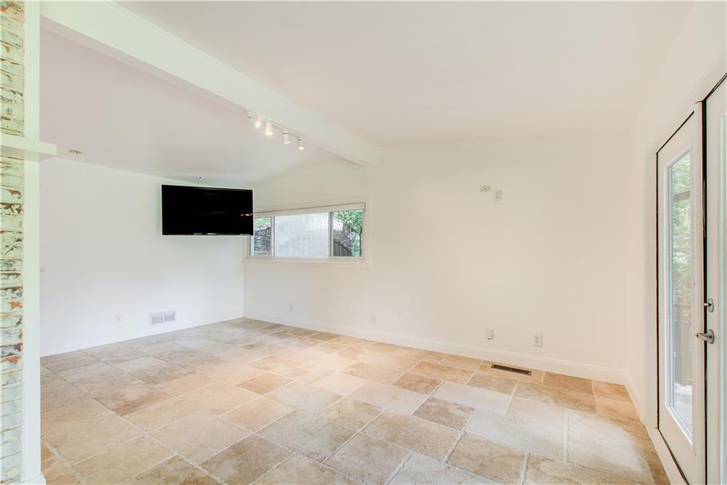 1676 Moores Mill Road Northwest Atlanta, GA 30327 - Photo 7 of 32 an empty room with windows