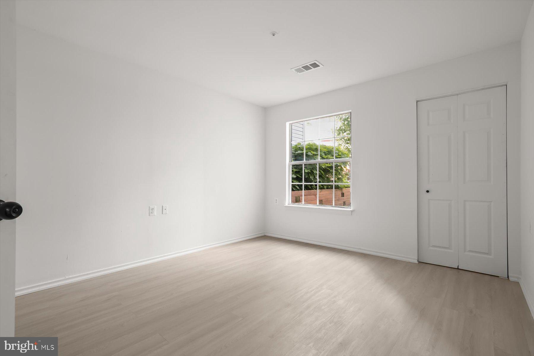 18521 Boysenberry Drive, Unit 242172 Gaithersburg, MD 20879 - Photo 13 of 43 an empty room with windows