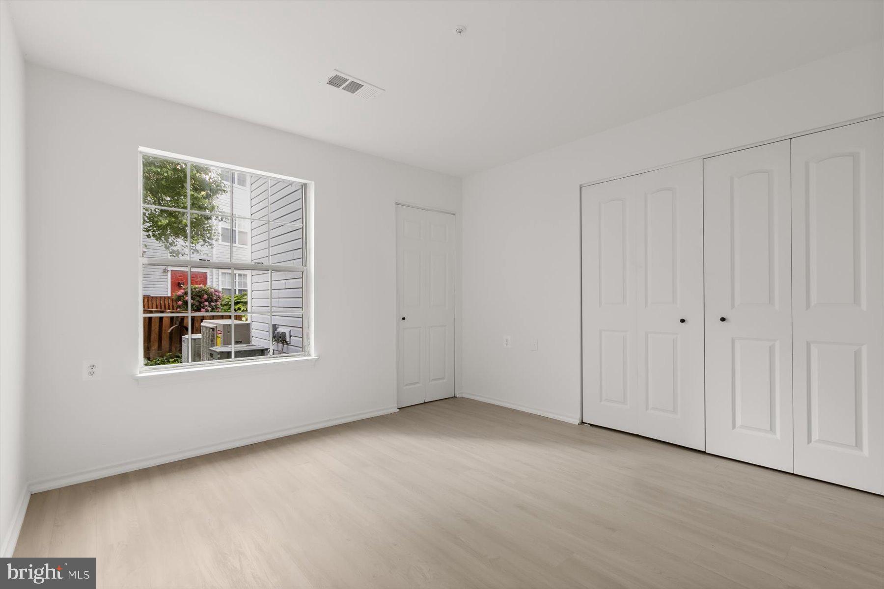 18521 Boysenberry Drive, Unit 242172 Gaithersburg, MD 20879 - Photo 14 of 43 a view of an empty room with a window