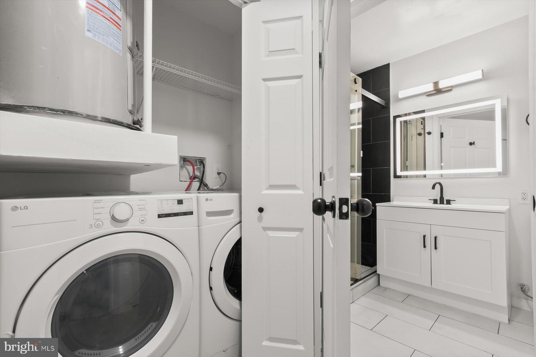 18521 Boysenberry Drive, Unit 242172 Gaithersburg, MD 20879 - Photo 17 of 43 a view of a hallway with washer and dryer