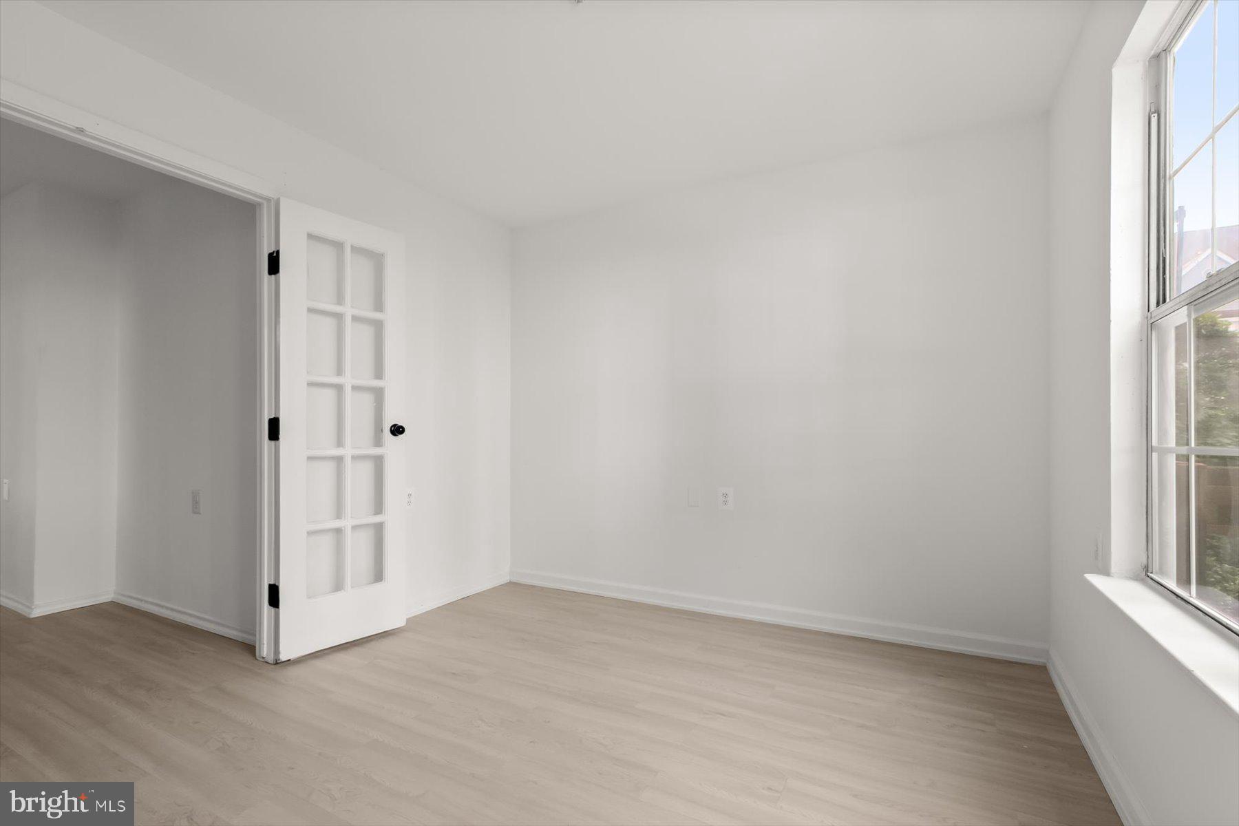 18521 Boysenberry Drive, Unit 242172 Gaithersburg, MD 20879 - Photo 24 of 43 a view of an empty room with a window
