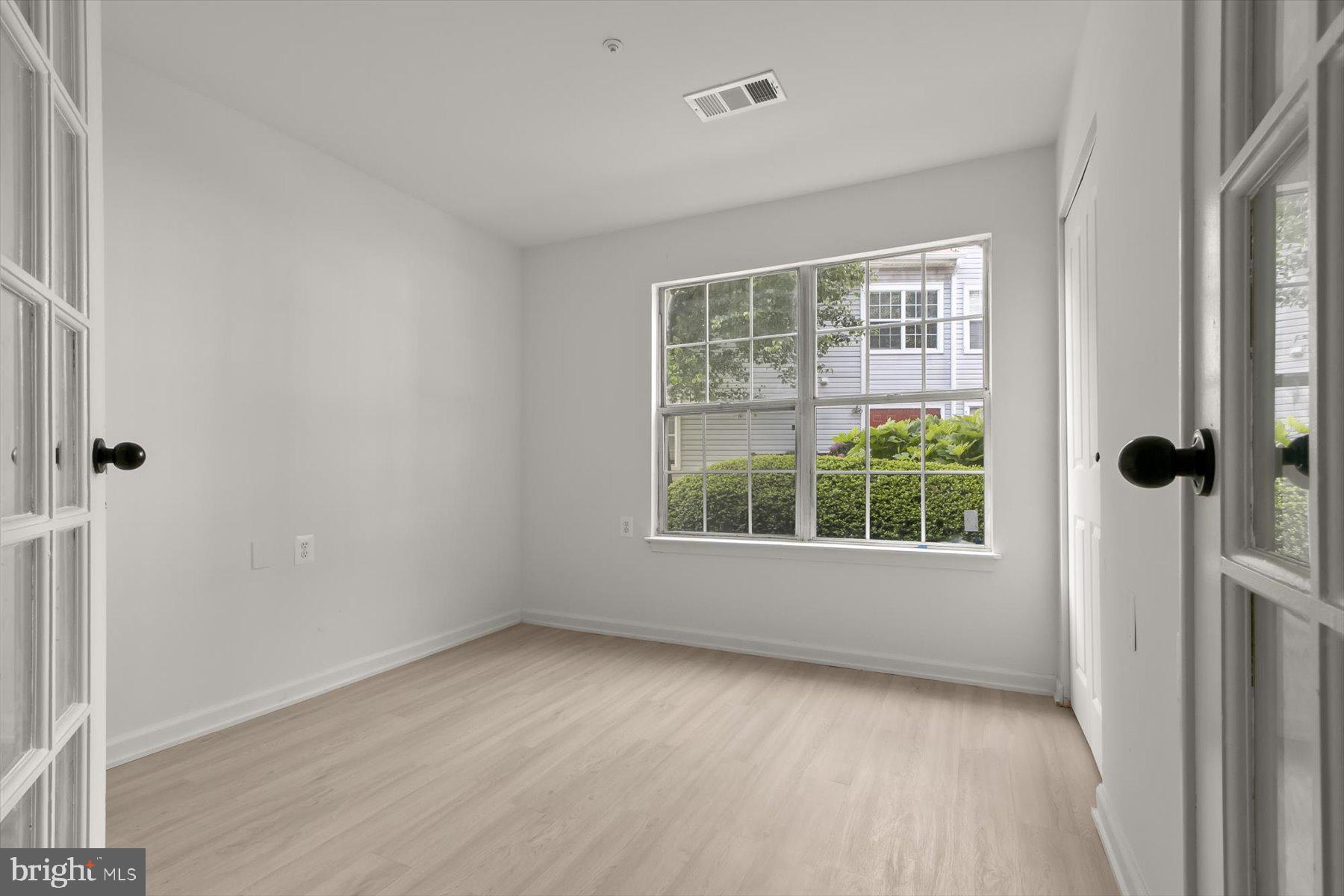 18521 Boysenberry Drive, Unit 242172 Gaithersburg, MD 20879 - Photo 25 of 43 an empty room with a window