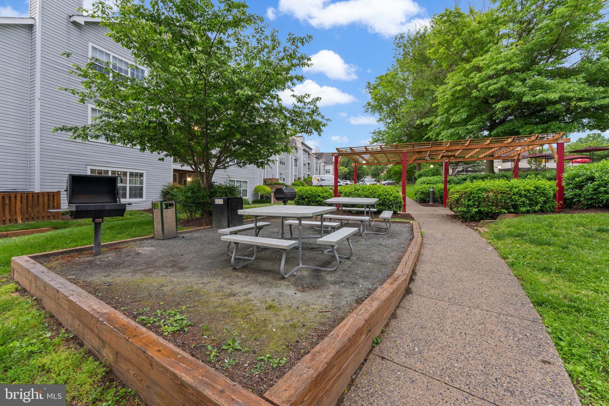 18521 Boysenberry Drive, Unit 242172 Gaithersburg, MD 20879 - Photo 29 of 43 a view of a backyard with sitting area