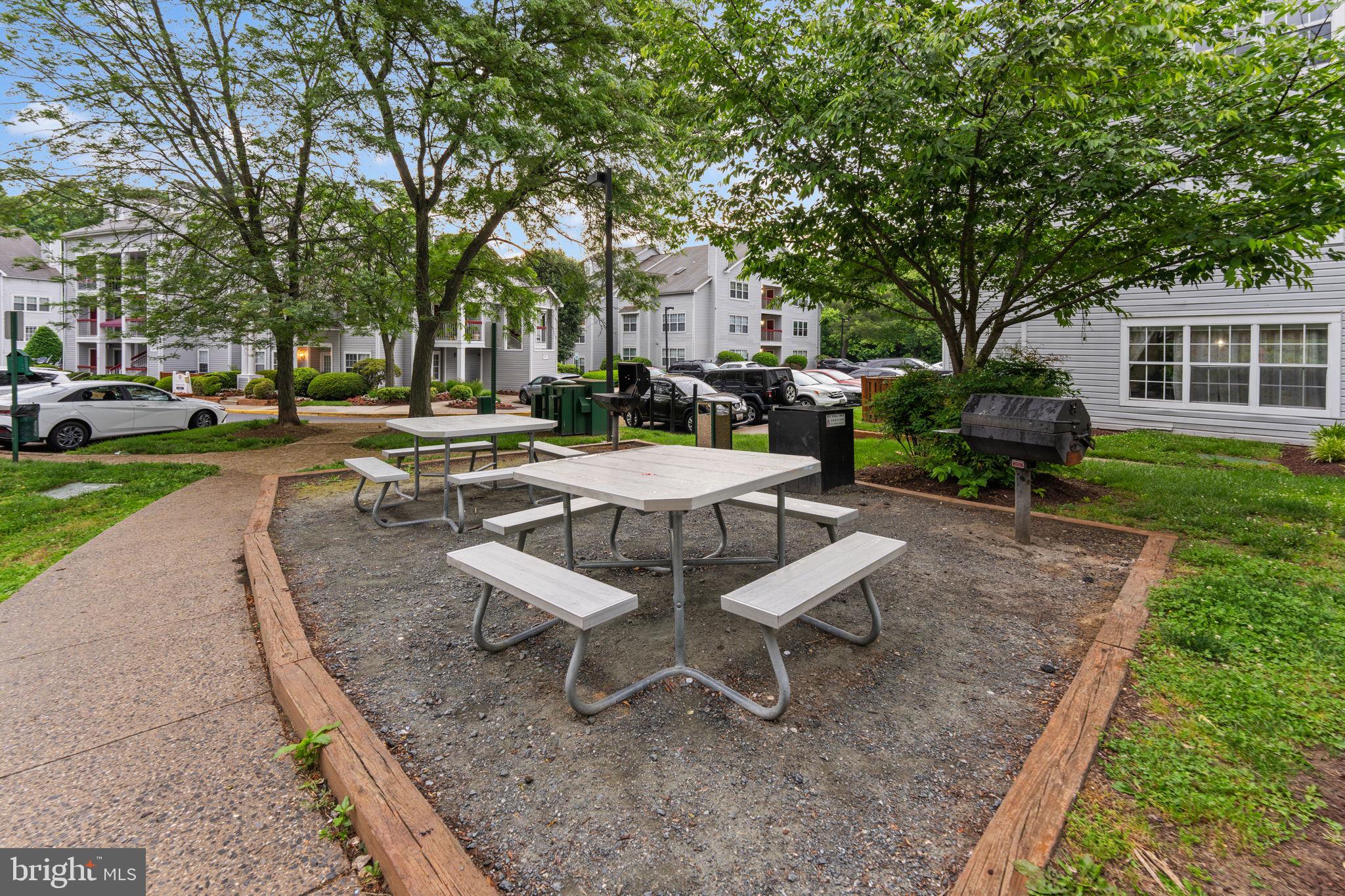18521 Boysenberry Drive, Unit 242172 Gaithersburg, MD 20879 - Photo 30 of 43 a view of a backyard with sitting area